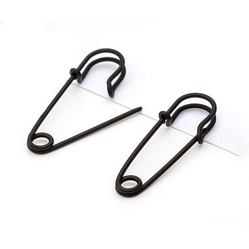 Trendy black safety pin earrings featuring a punk rock style, perfect for unisex alternative fashion.
