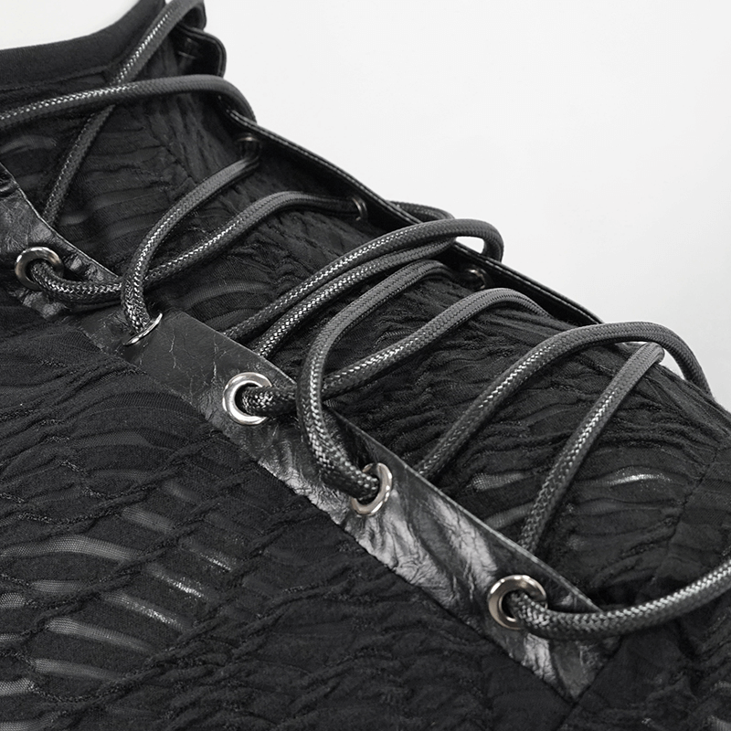 Close-up of lacing detail on a black turtleneck sweatshirt, highlighting trendy punk style.