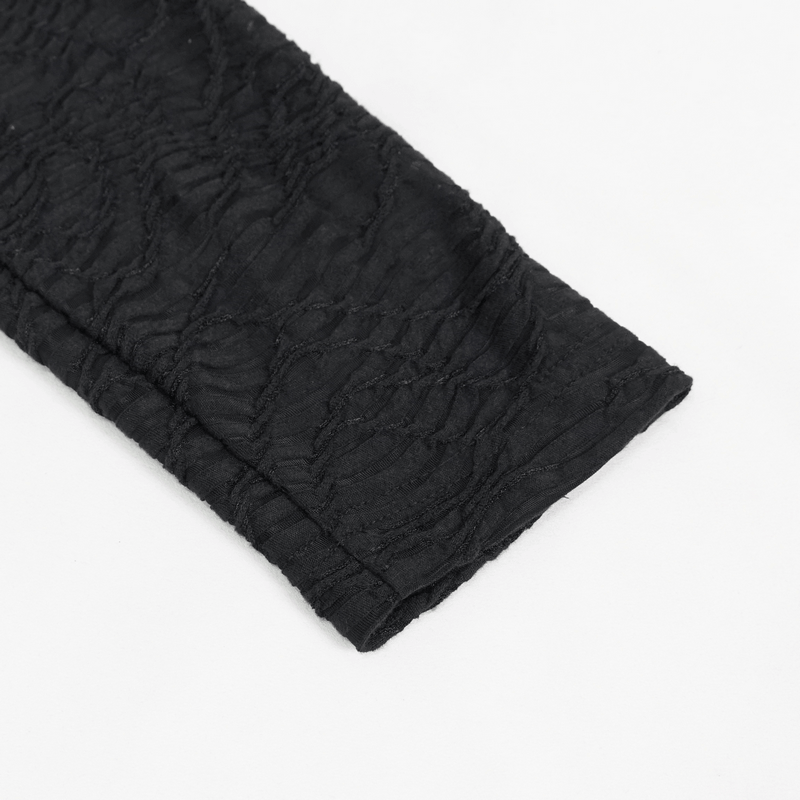 Close-up of a textured black sleeve of a men's turtleneck sweatshirt with a trendy punk style.