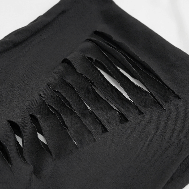 Close-up of ripped holes on a stylish men's black gothic hoodie, showcasing edgy fashion detail.