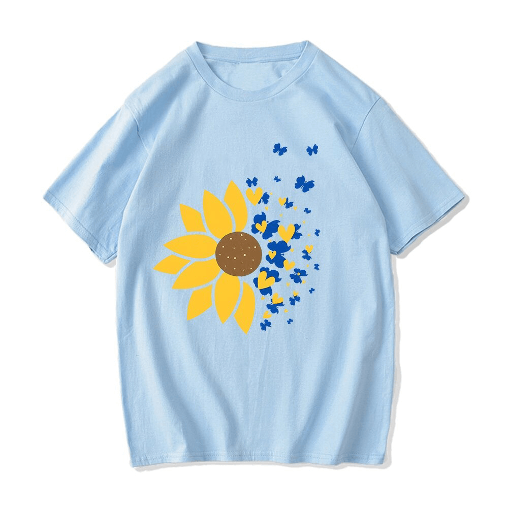 Blue oversized t-shirt featuring a vibrant sunflower and butterfly print, perfect for casual wear.