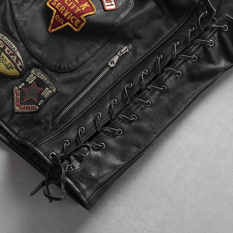 Men's cowhide leather biker vest with vintage patches and stylish lace-ups for a rock fashion look.