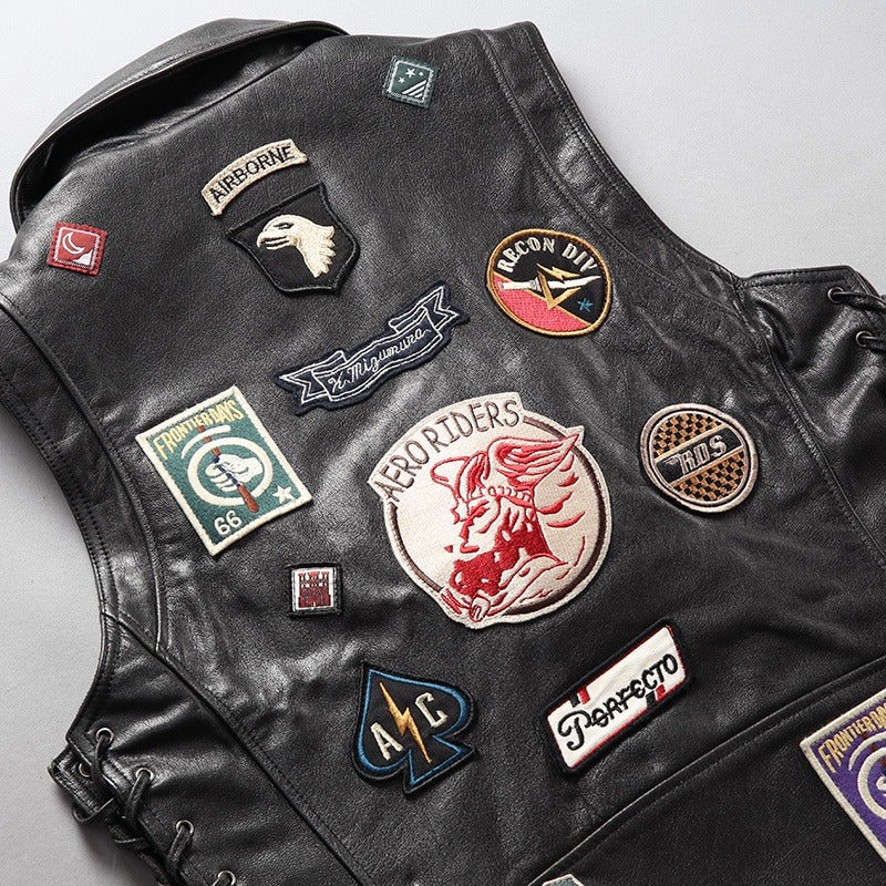 Men's cowhide leather rider vest featuring unique patches and vintage biker style decorations.