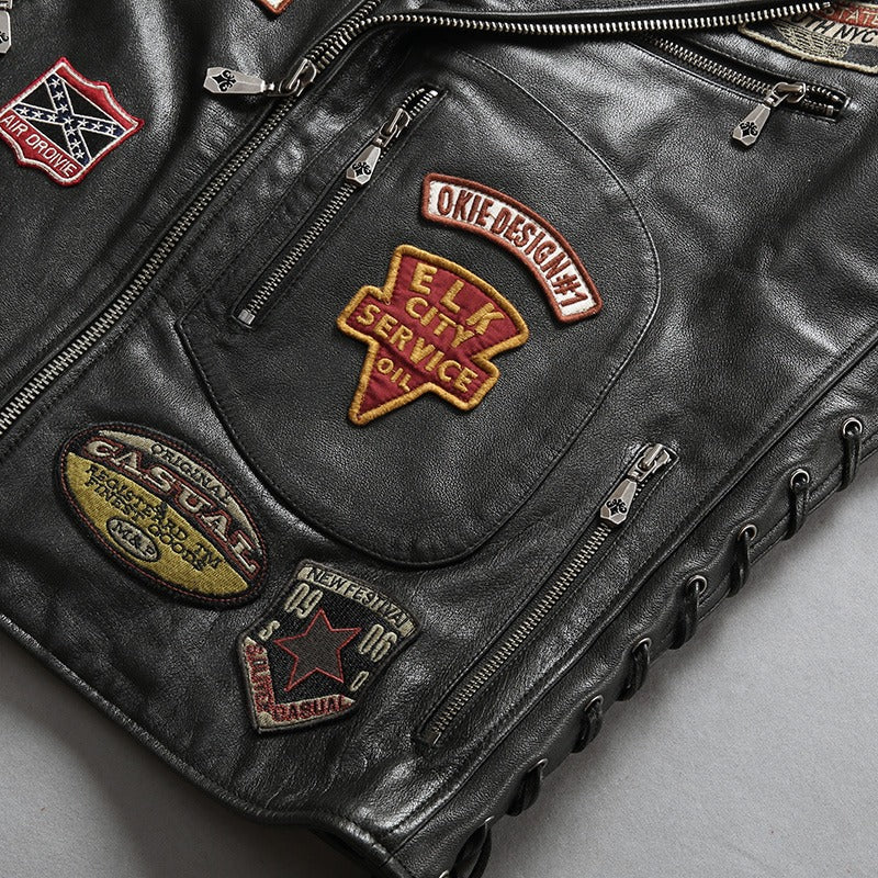 Men's cowhide leather biker vest featuring vintage patches and zippers for a stylish rider look.
