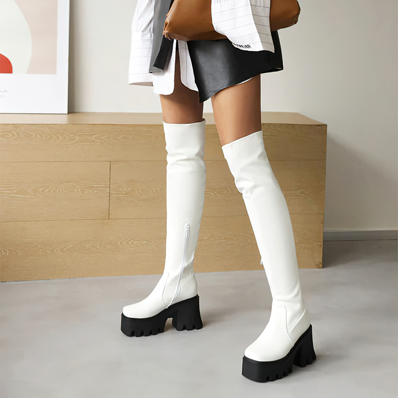 Chic white over-the-knee boots with black platform heels, perfect for adding style to any autumn or winter outfit.