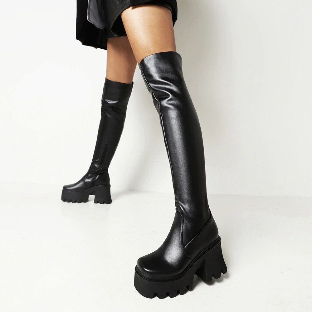 Sleek black over-the-knee PU leather boots with chunky fretwork heels, perfect for a grunge look this autumn.