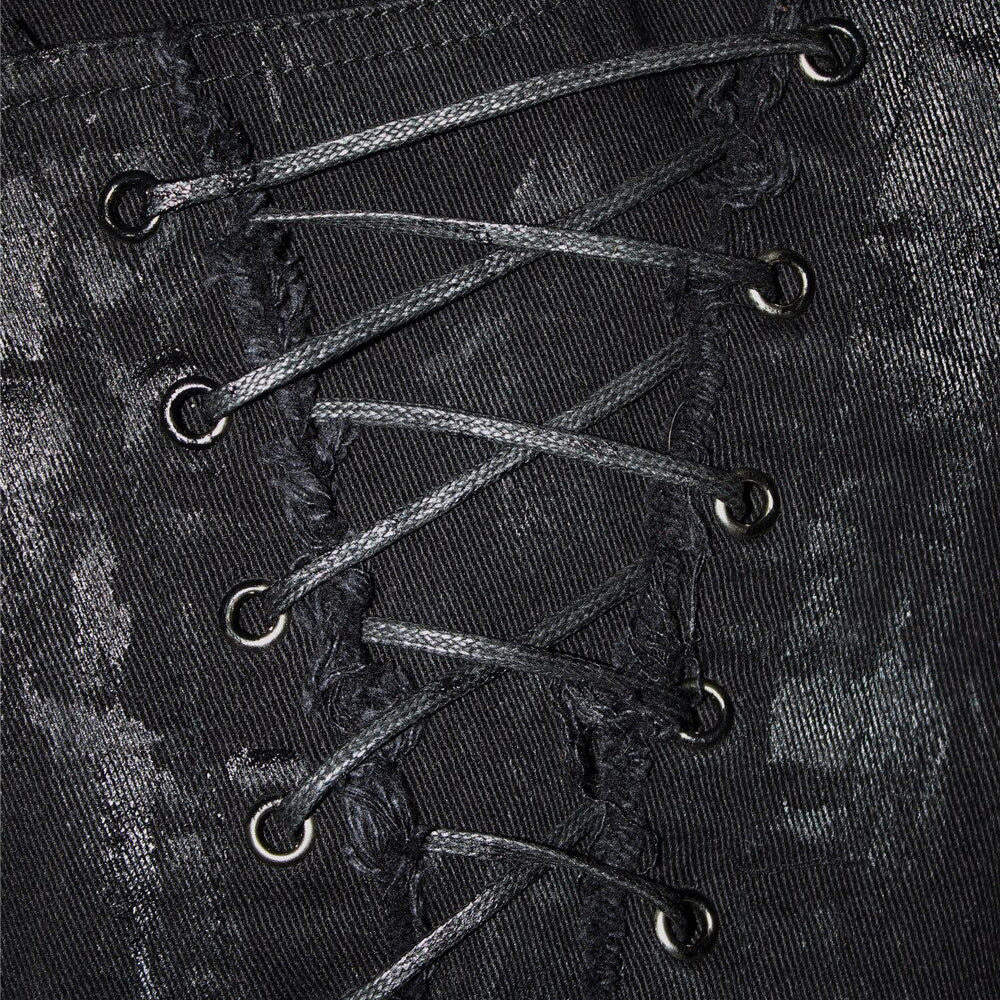 Close-up of unique lacing detail on black steampunk jeans, showcasing alternative fashion in women's streetwear.