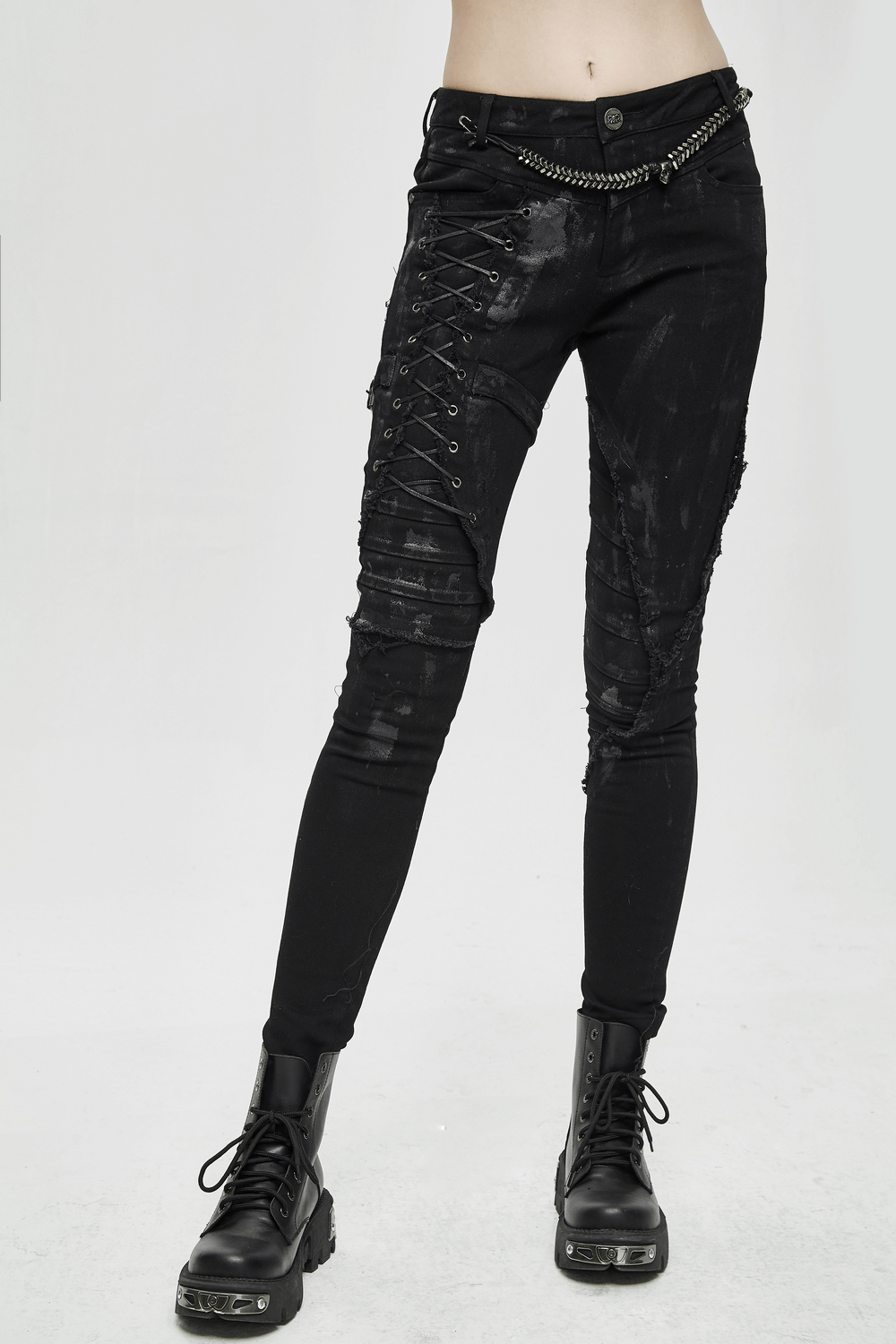 Unique women's steampunk skinny black denim trousers with lacing and belt detail, perfect for alternative streetwear fashion.
