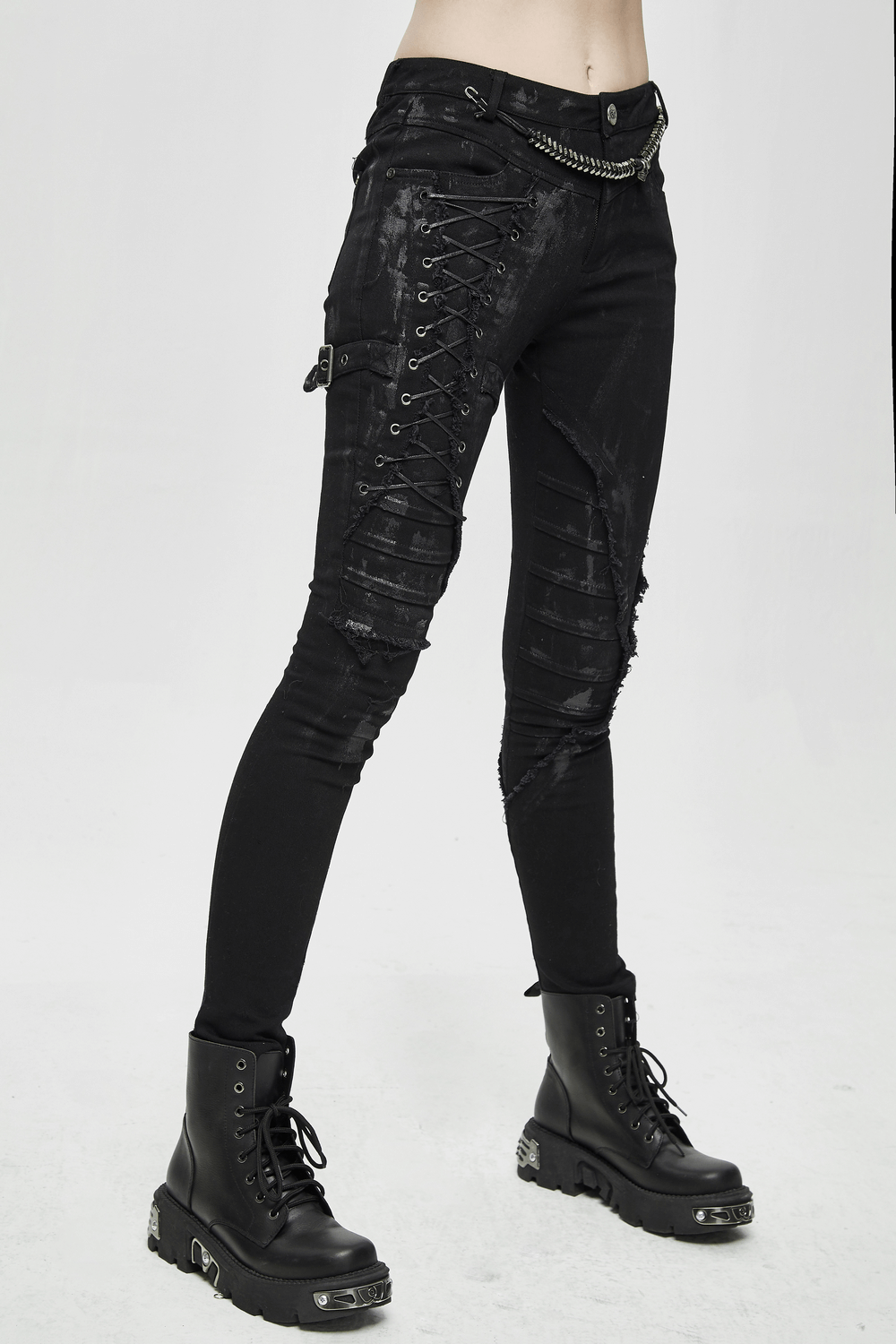 Unique women's steampunk skinny black jeans featuring side lacing and distressed details, perfect for alternative streetwear.