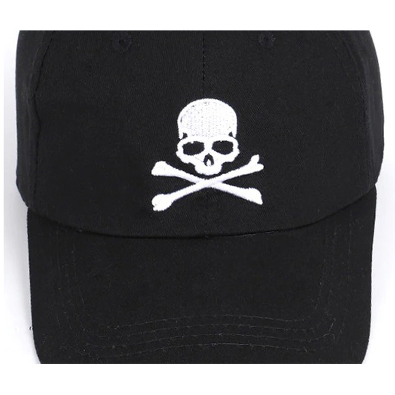 Unisex black baseball cap with pirate skull and crossbones print for a rock-style casual look.