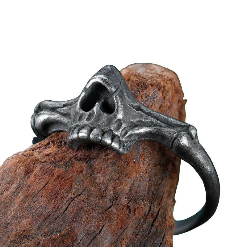 Unisex black skull ring made of stainless steel, featuring a unique skeleton design, perfect for alternative fashion enthusiasts.