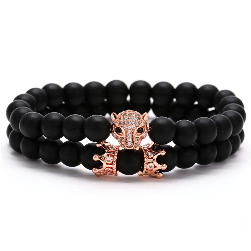 Unisex bracelet of lava stone beads featuring a beast head and crown design in stylish black rock style.