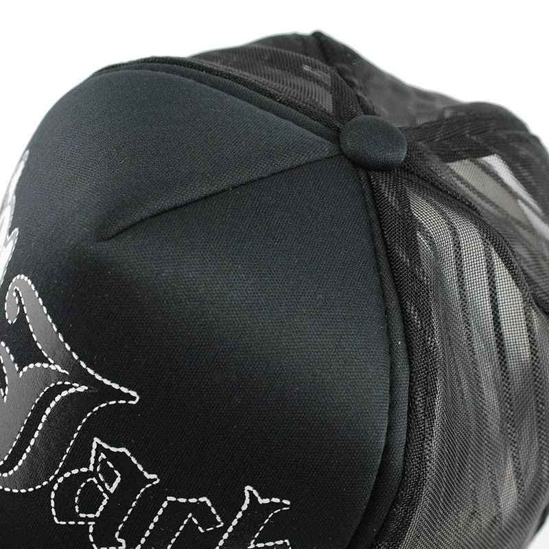 Close-up of unisex breathable black baseball cap with mesh and stylish skull print detail.