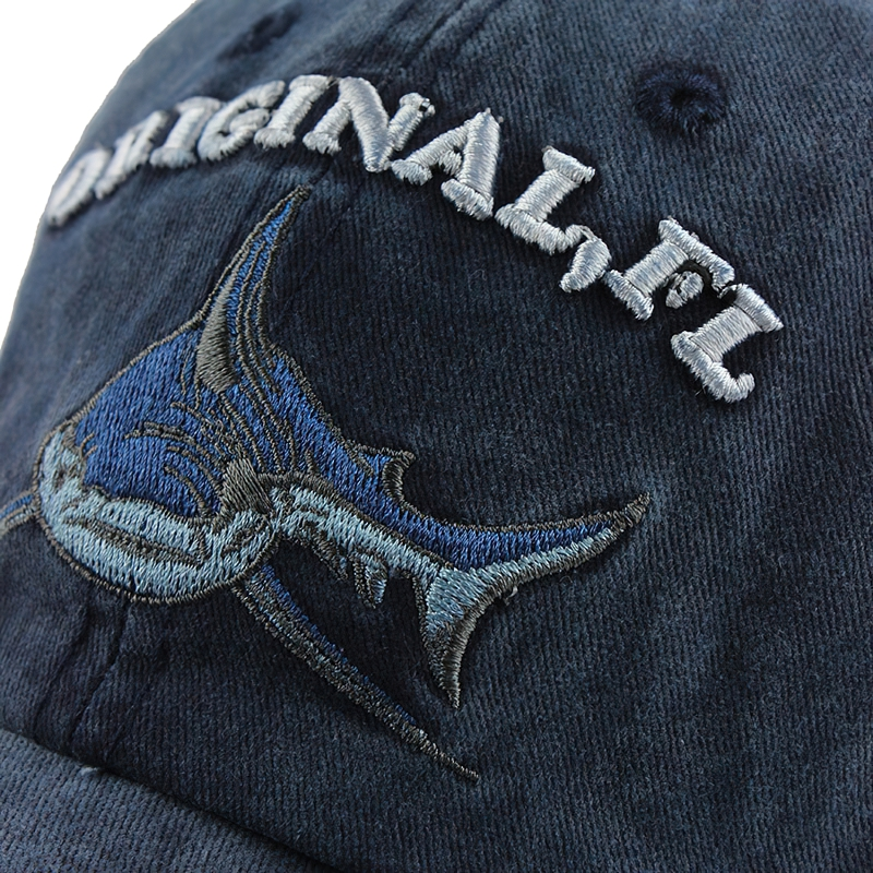 Close-up of stylish unisex baseball cap featuring shark embroidery, perfect for casual outings and sun protection.