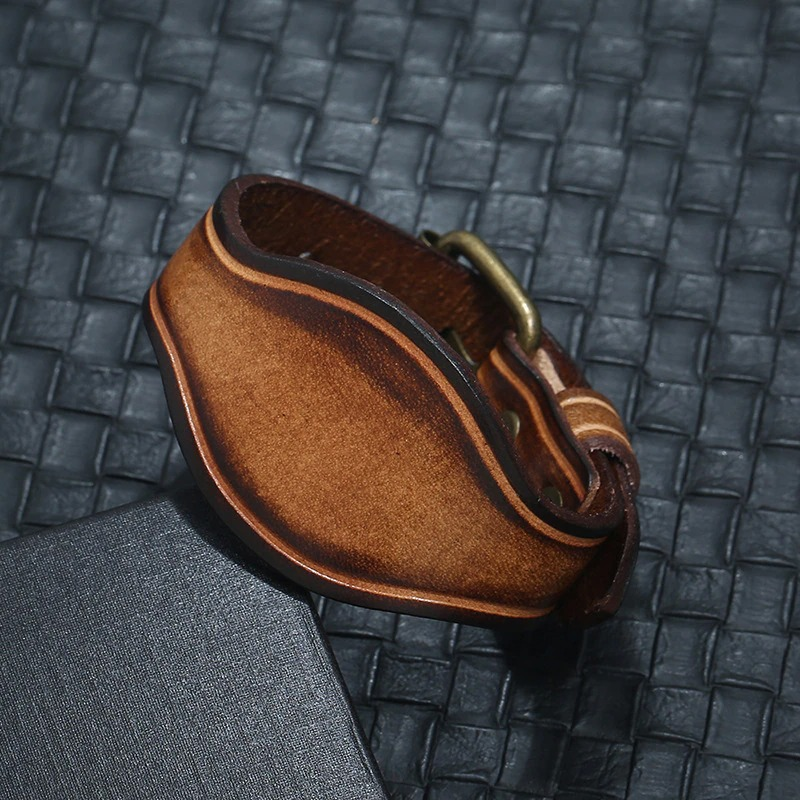 Unisex wide vintage brown leather bracelet, perfect for punk style outfits and versatile fashion looks.