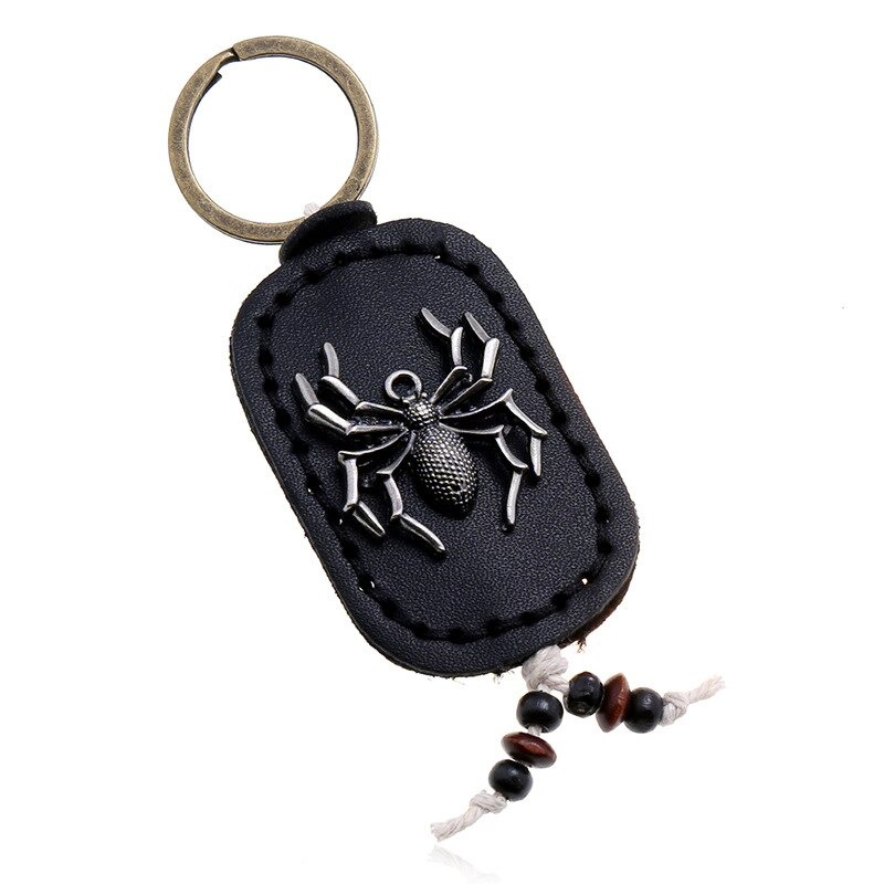 Unisex vintage leather keychain featuring a spider pendant in zinc alloy, perfect for bags or as a unique gift.