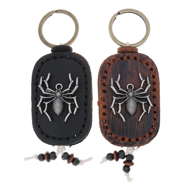 Unisex genuine leather handmade vintage keychain featuring a spider pendant, perfect for accessorizing bags.