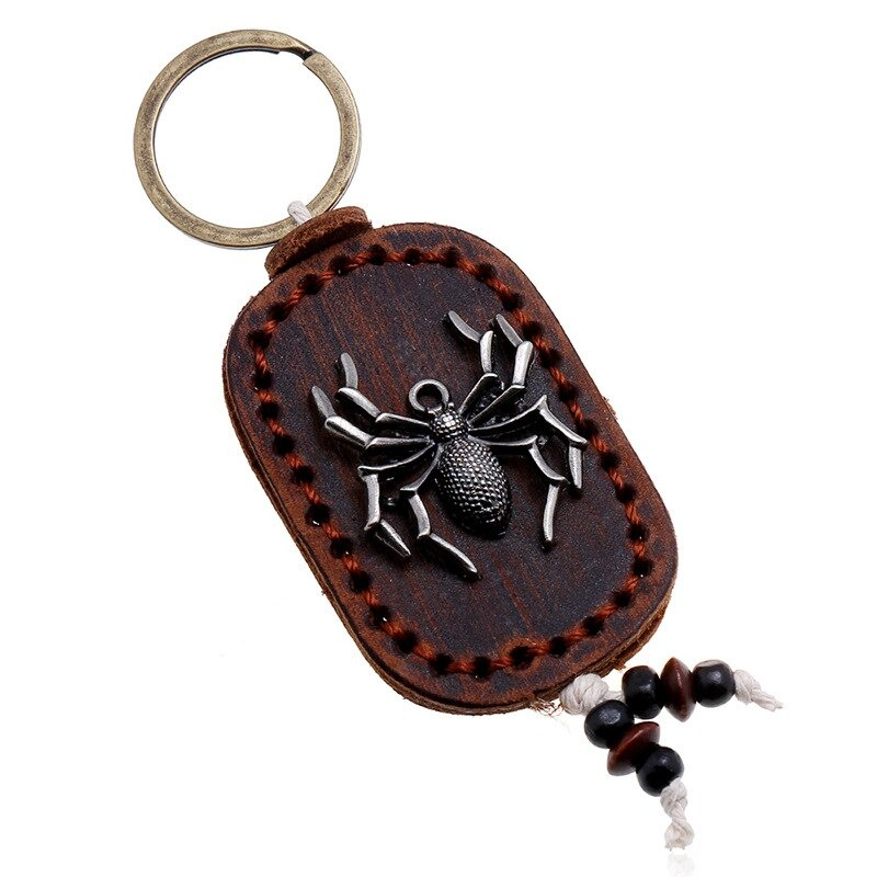 Vintage unisex genuine leather keychain featuring a spider pendant in zinc alloy, perfect for personalizing bags.