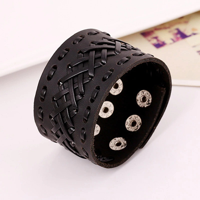 Handmade unisex black leather wide bracelet with woven design and decorative studs, perfect for punk fashion.