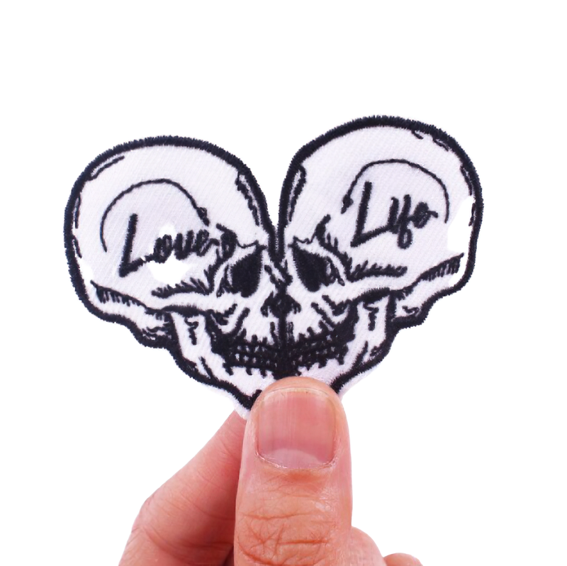 Unisex heart-shaped patch featuring two skulls, ideal for stylish gothic rave outfits and accessories.