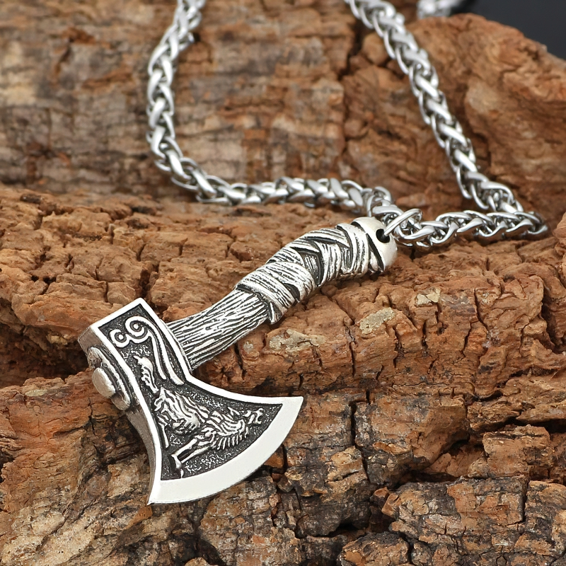 Stylish unisex Viking axe pendant necklace with intricate design on wood background