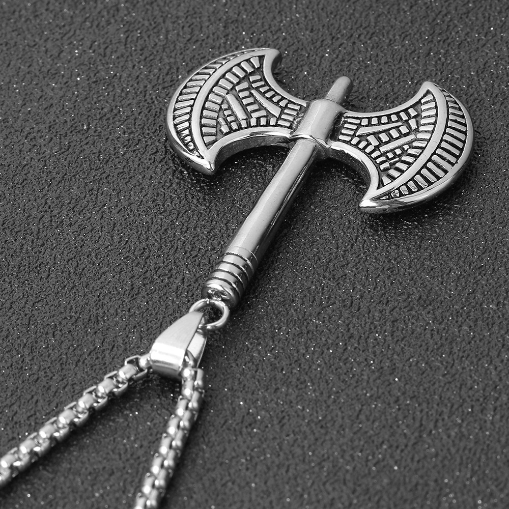 Handmade stainless steel Viking tomahawk pendant necklace for a punk rock look.
