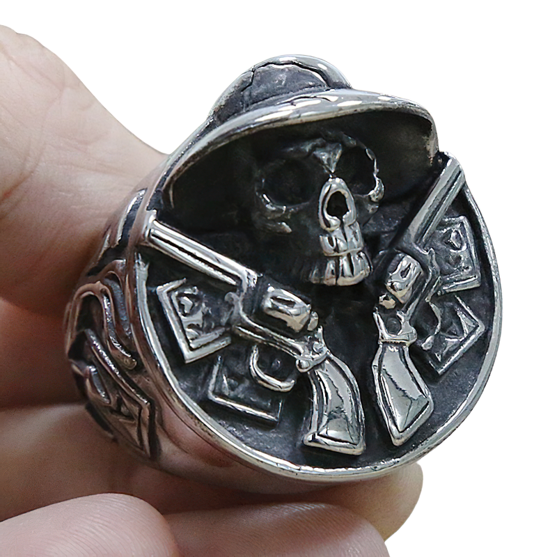 Unisex stainless steel ring featuring a cowboy skull design with double gun revolvers, perfect for gothic style.