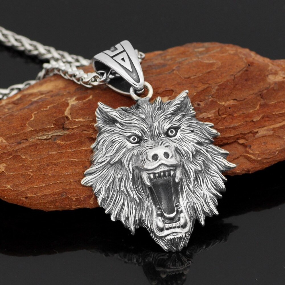 Unisex rock style wolf head pendant in sterling silver, perfect for vintage jewelry lovers.