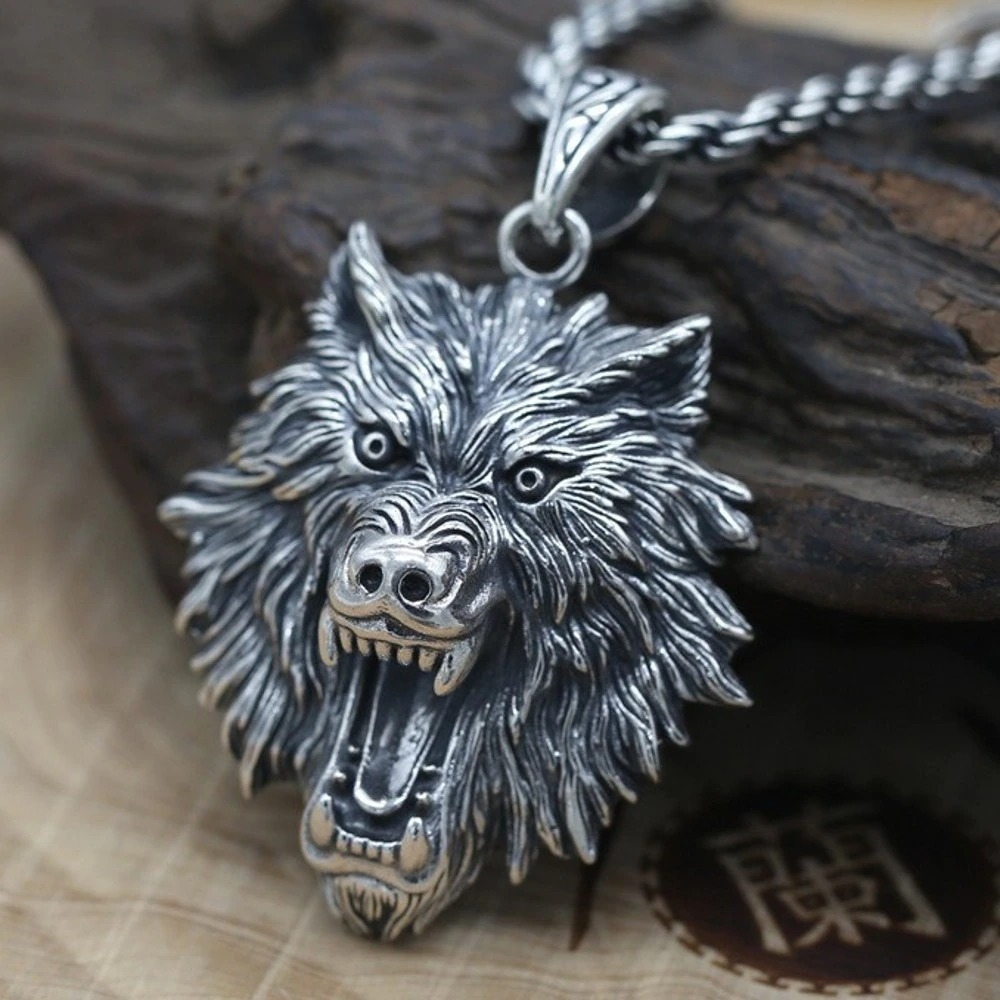 Unisex wolf head pendant in sterling silver, perfect for rock-style jewelry enthusiasts.
