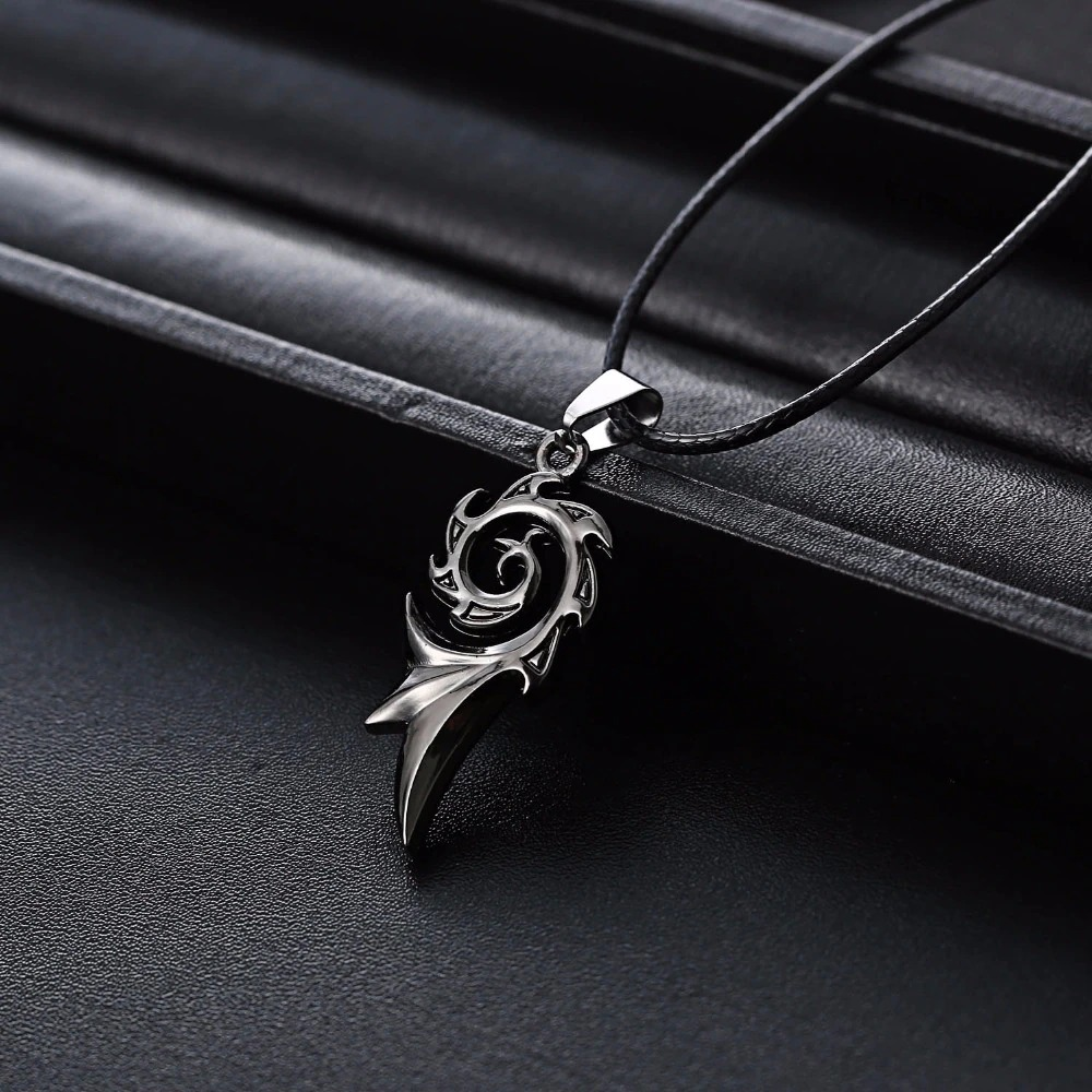 Unisex stainless steel dragon flame pendant necklace on a black leather background, showcasing a bold rock style.