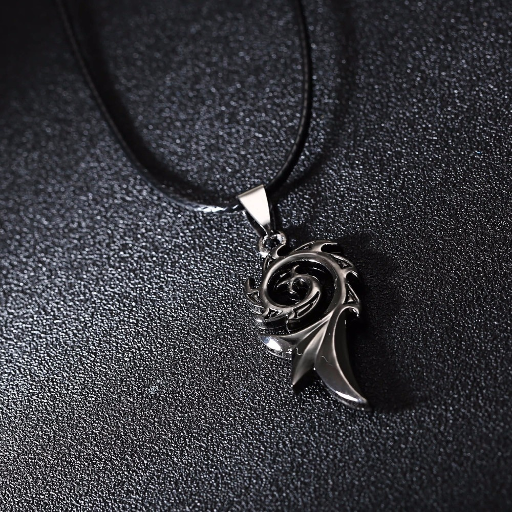Unisex vintage stainless steel pendant featuring a dragon flame design on a black cord.