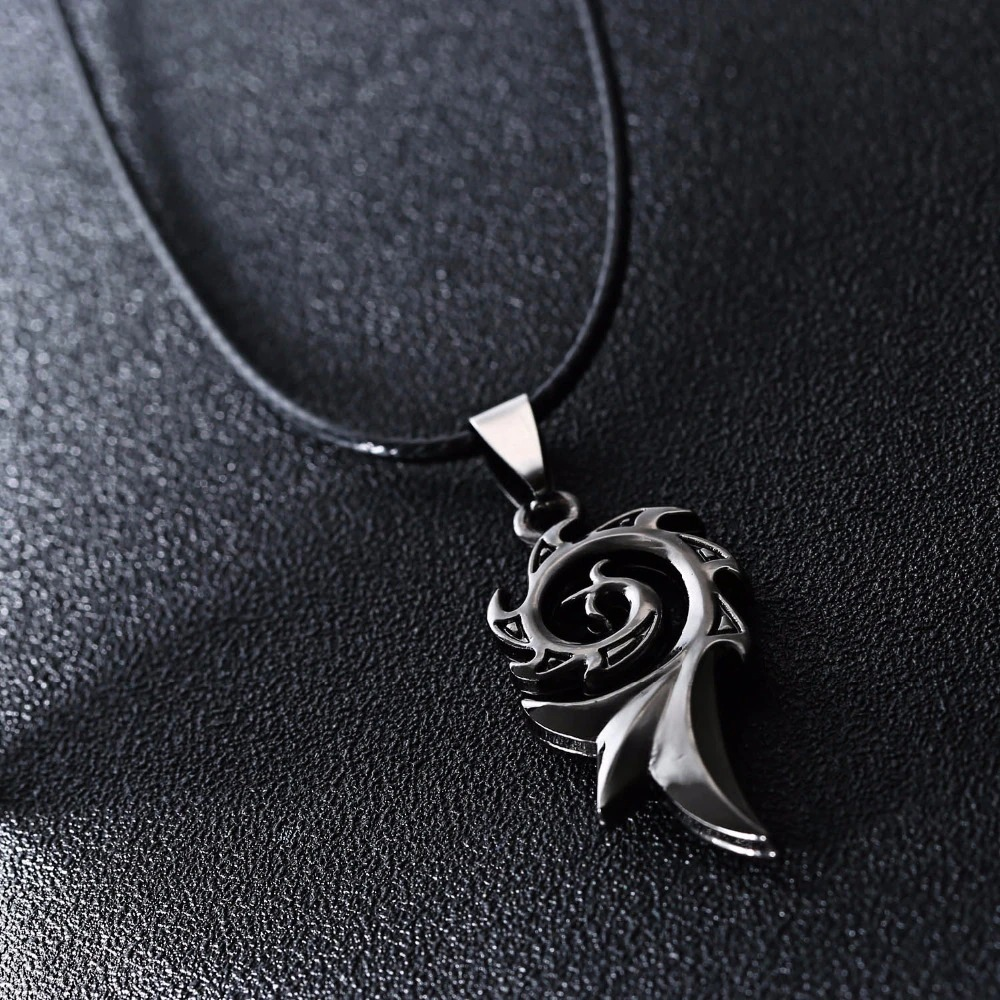 Cool unisex stainless steel dragon flame pendant necklace on a dark background.