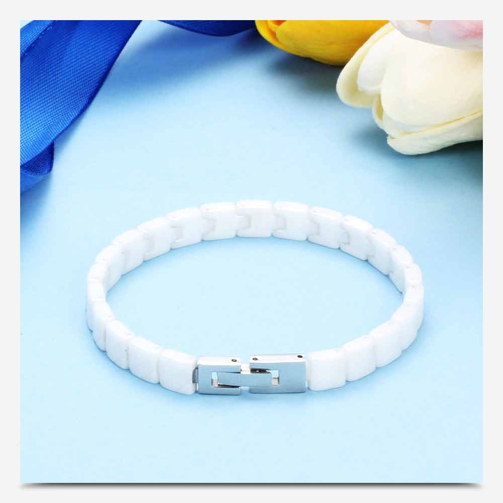 Unisex white stainless steel bracelet with toggle clasp on blue background, perfect trendy jewelry for all occasions.