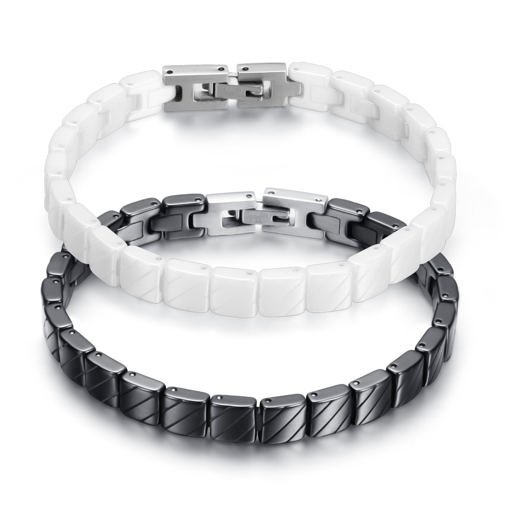 Unisex stainless steel bracelet in black and white colors, featuring a trendy design with toggle clasps.