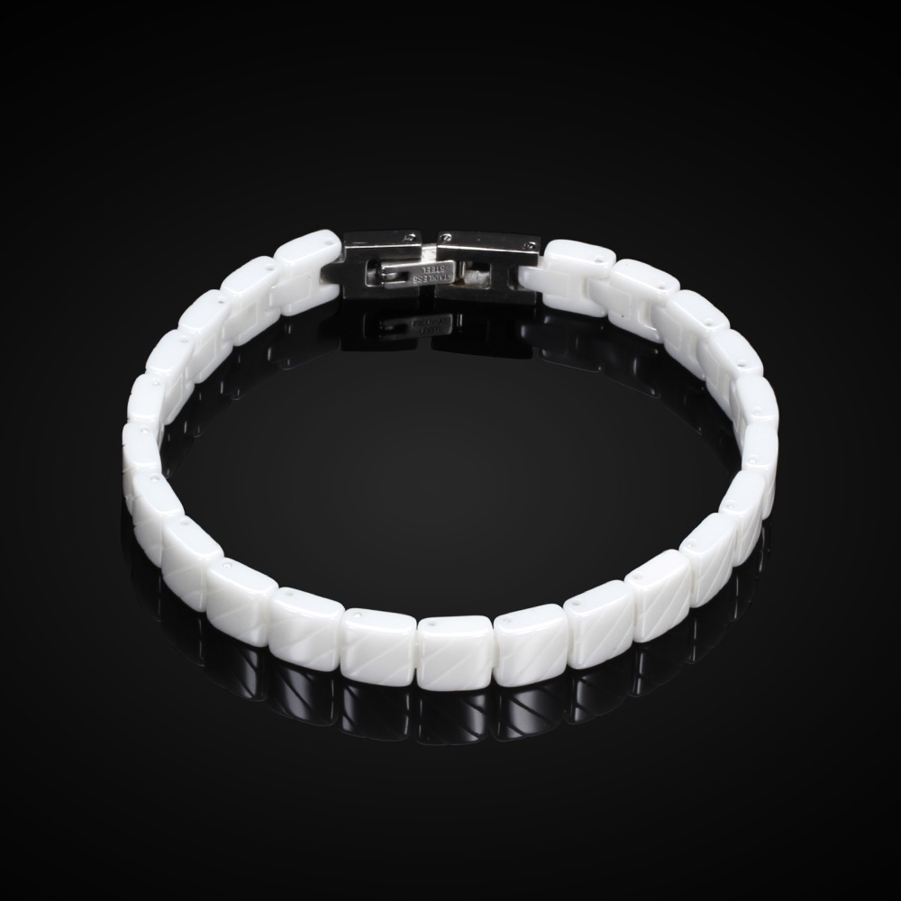 Unisex stainless steel bracelet in white, showcasing a trendy design with toggle-clasps and a modern aesthetic.