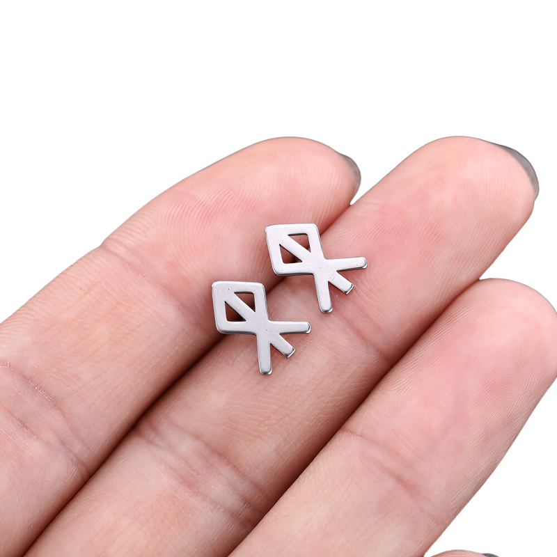 Unisex vintage silver gothic earrings in stainless steel, showcased in a model's hand for stylish accessory ideas.