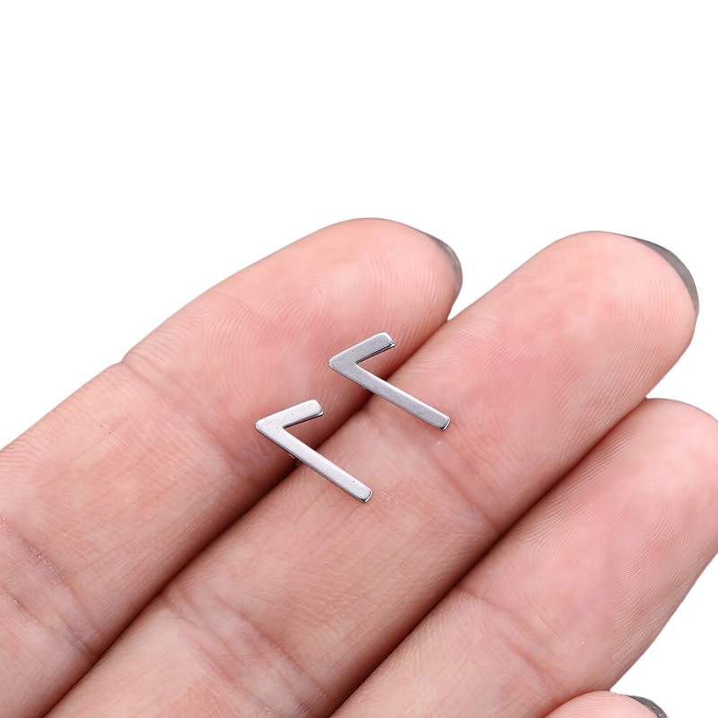 Stylish unisex vintage Gothic stainless steel earrings held in hand, perfect for any outfit.