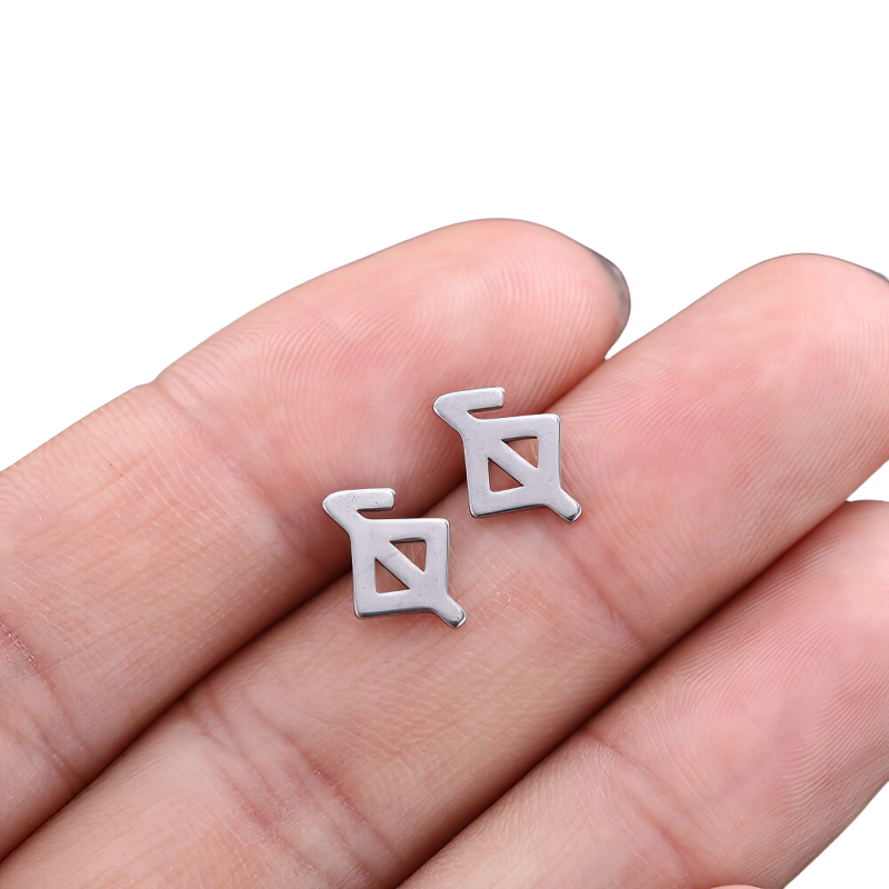 Unisex vintage silver earrings in gothic style, made of stainless steel, displayed on a hand.