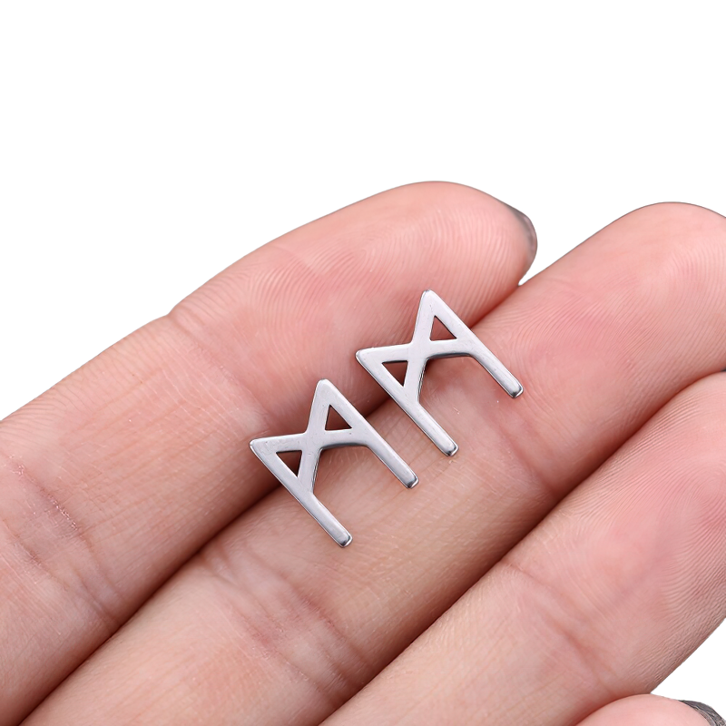 Unisex stainless steel vintage gothic earrings held in a hand, showcasing a stylish and trendy design.