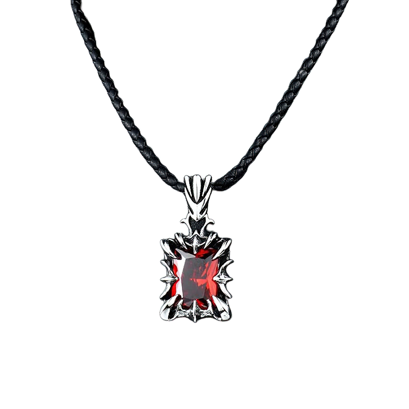 Unisex stainless steel gothic pendant with red stone on a black braided cord, stylish accessory for casual fashion.