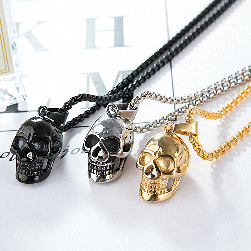 Unisex stainless steel skull necklaces in black, silver, and gold, perfect for rock style accessories.