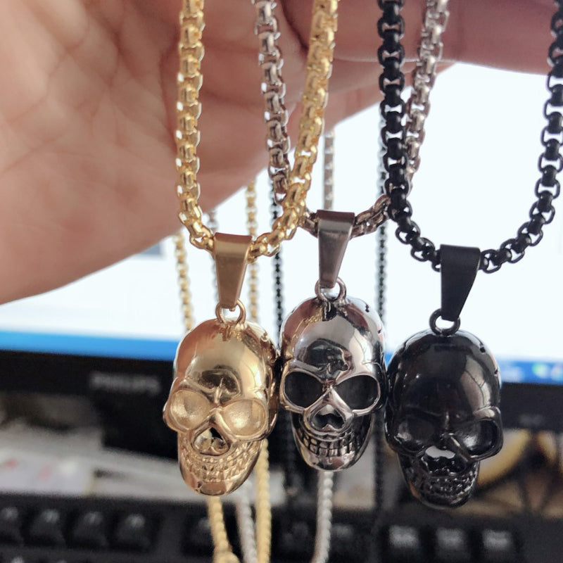 Unisex stainless steel skull necklaces in gold, silver, and black with O-chains, perfect for biker rock style.