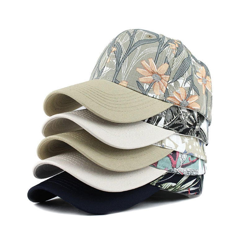 A stylish stack of unisex baseball caps featuring floral patterns and various colors, perfect for casual street style.
