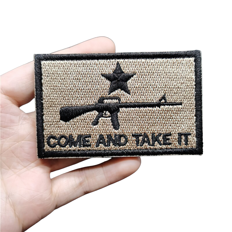 Unisex vintage khaki military patch featuring a gun machine and star, perfect for tactical style and decoration.