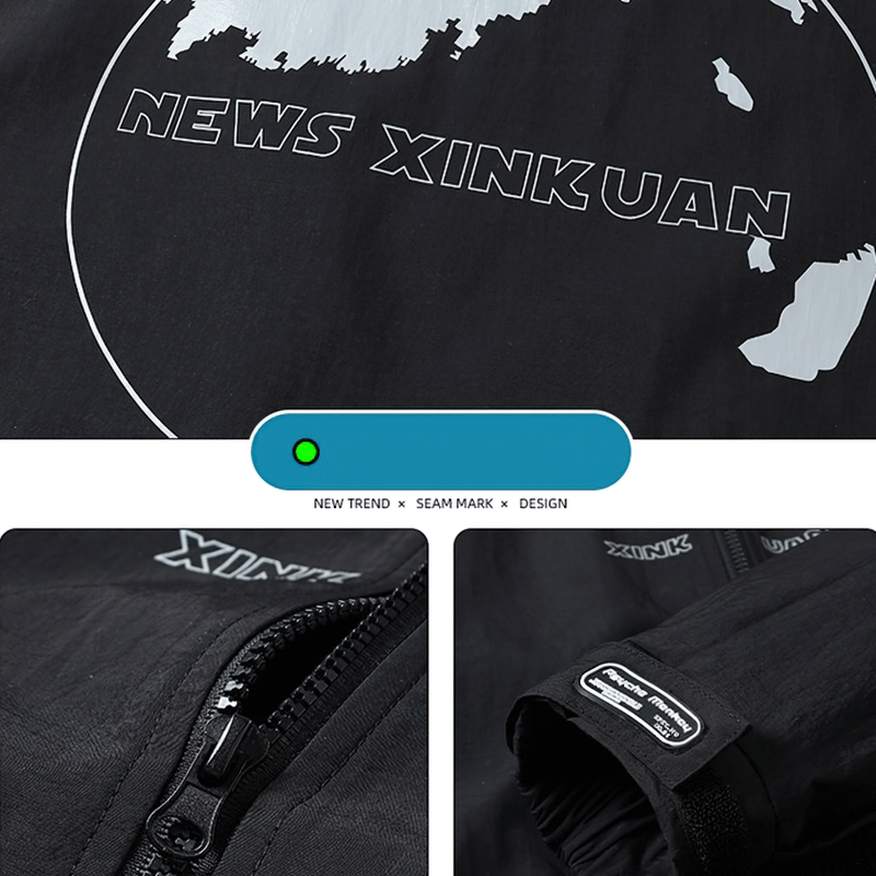 Close-up of black windbreaker jacket featuring 'NEWS XINKUAN' print and zipper detail showcasing modern design.