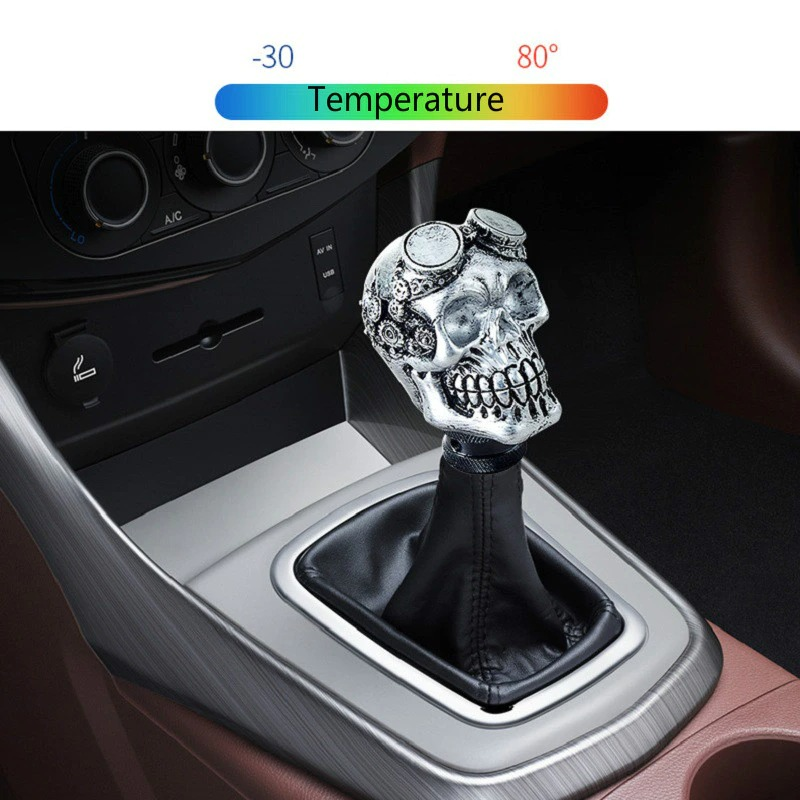 Gothic skull gearshift knob accessory in car interior, adding creativity and style.