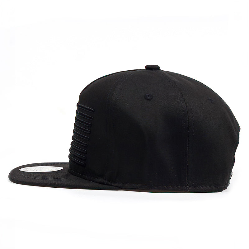 Black unisex snapback baseball cap with a textured side detail and flat brim, perfect for stylish casual wear.