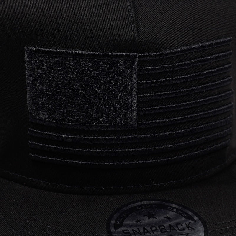 USA flag embroidery detail on black snapback baseball cap, stylish and comfortable accessory for casual wear.