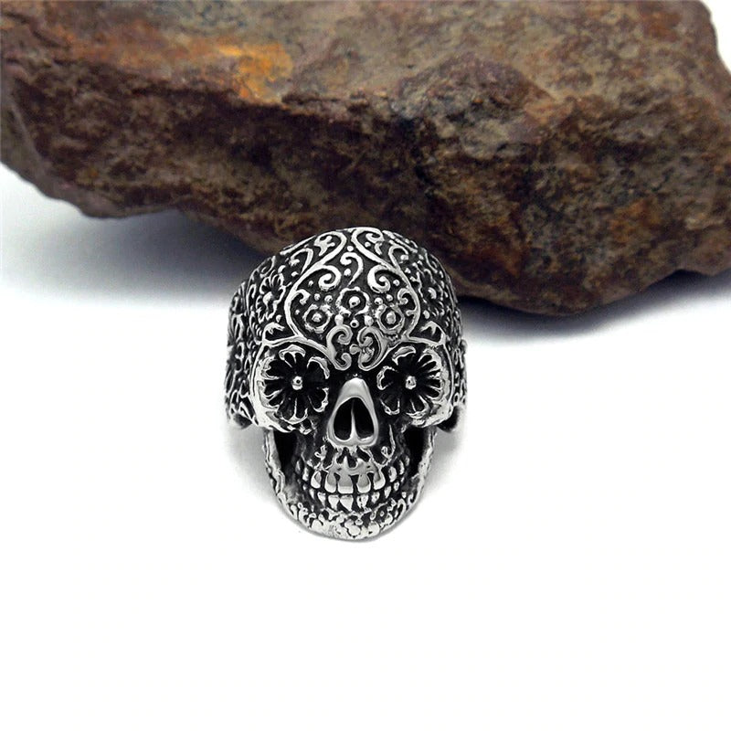 Vampire skull ring in intricate retro design, perfect for rock punk fashion enthusiasts, displayed on a textured stone surface.