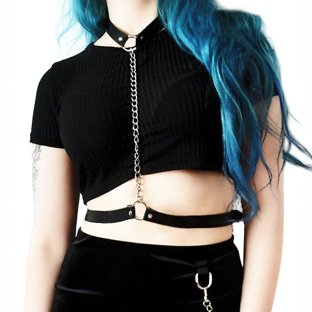 Vegan leather body harness with chain on a model, adding an edgy touch to any outfit.